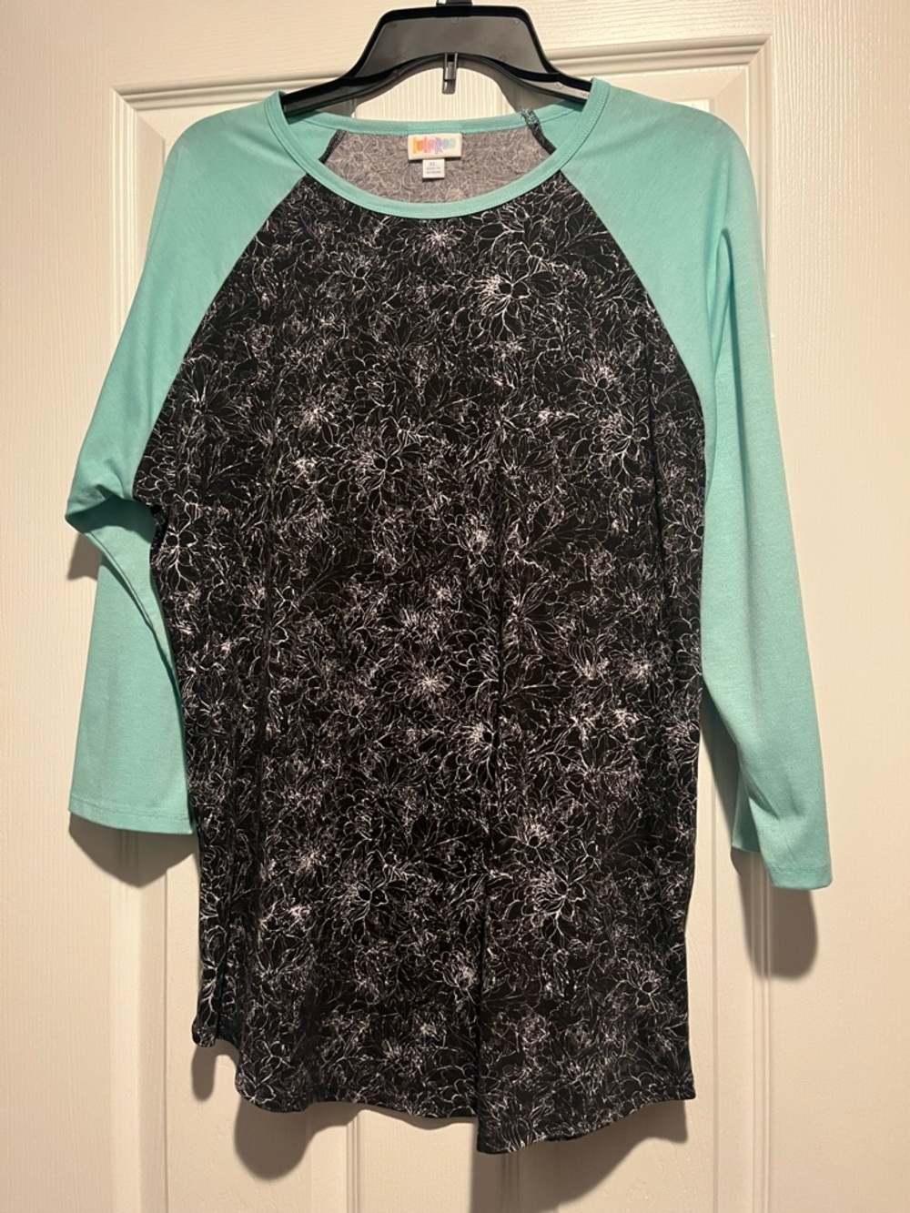 LuLaRoe Black Floral Raglan with Mint Green Sleeves